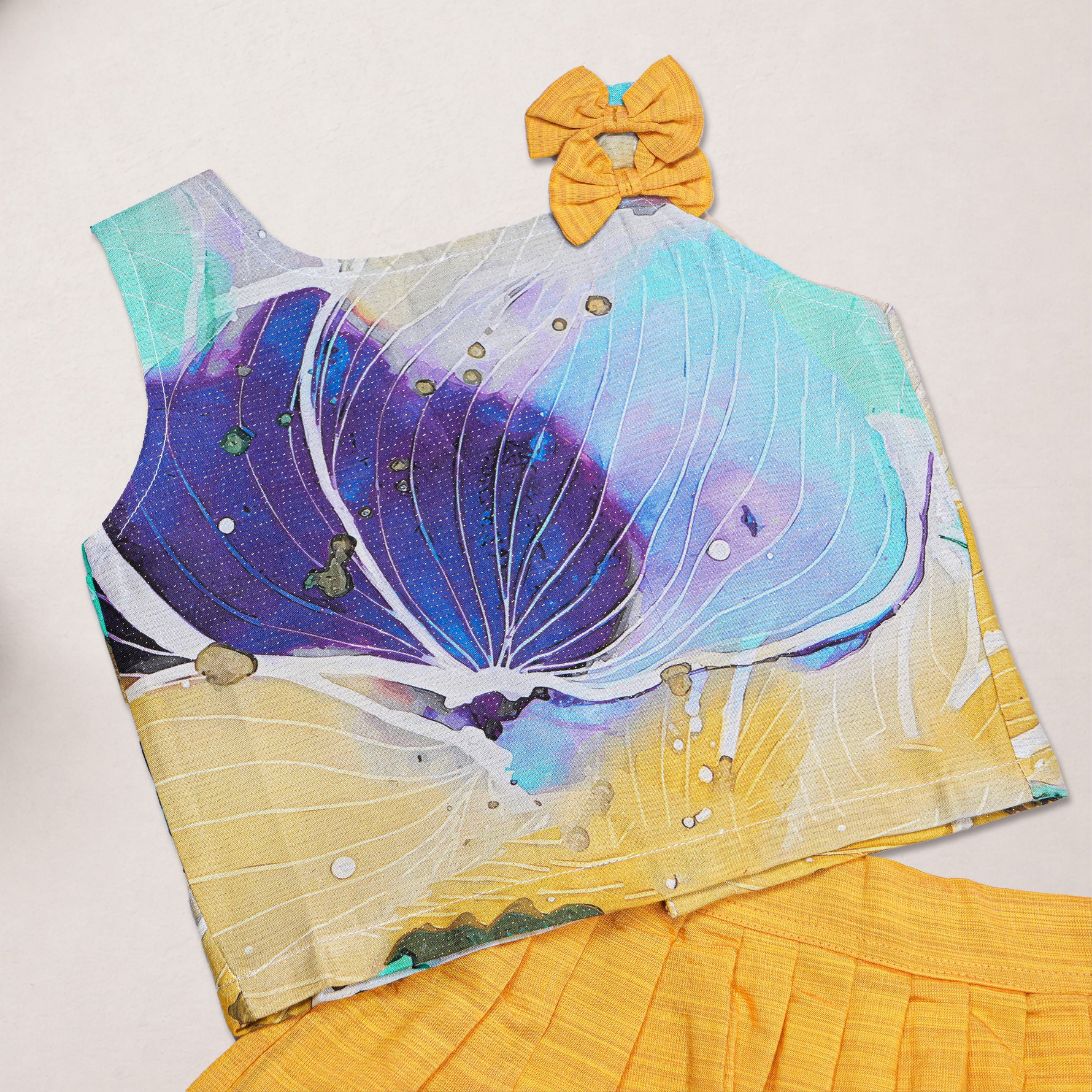 Girls floral printed ethnic top and mustard pleated skirt set by Boon Babies, featuring colorful floral design on the top and pleated skirt.