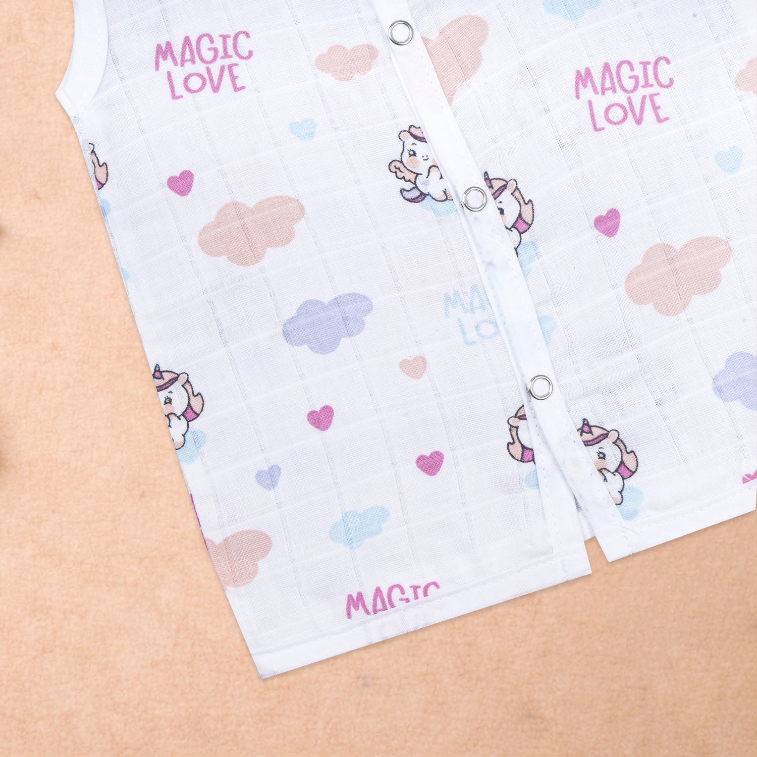 Baby wearing a sleeveless printed muslin jabla from Boon Babies, soft and breathable newborn wear for ages 0-12 months.