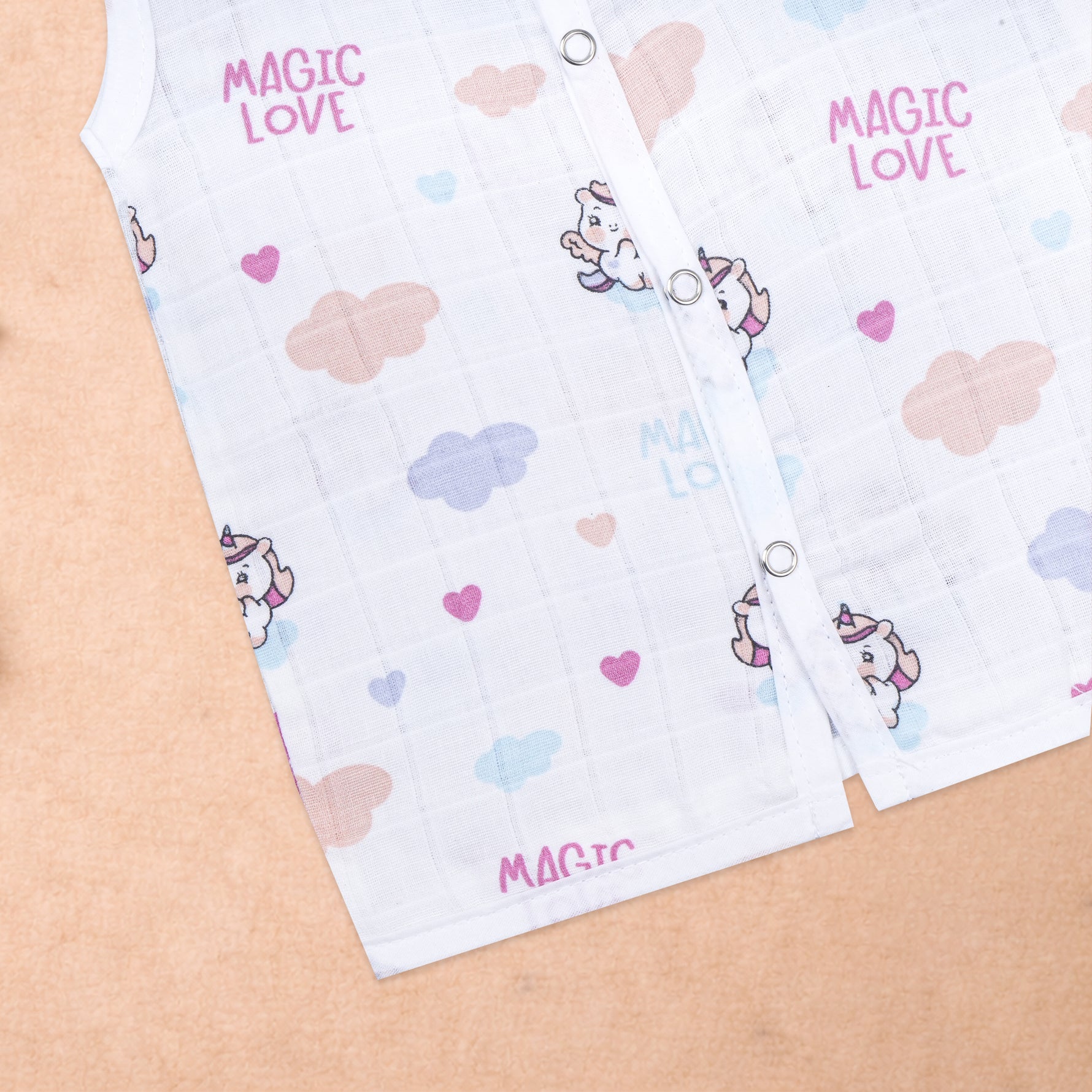 Baby wearing a sleeveless printed muslin jabla from Boon Babies, soft and breathable newborn wear for ages 0-12 months.
