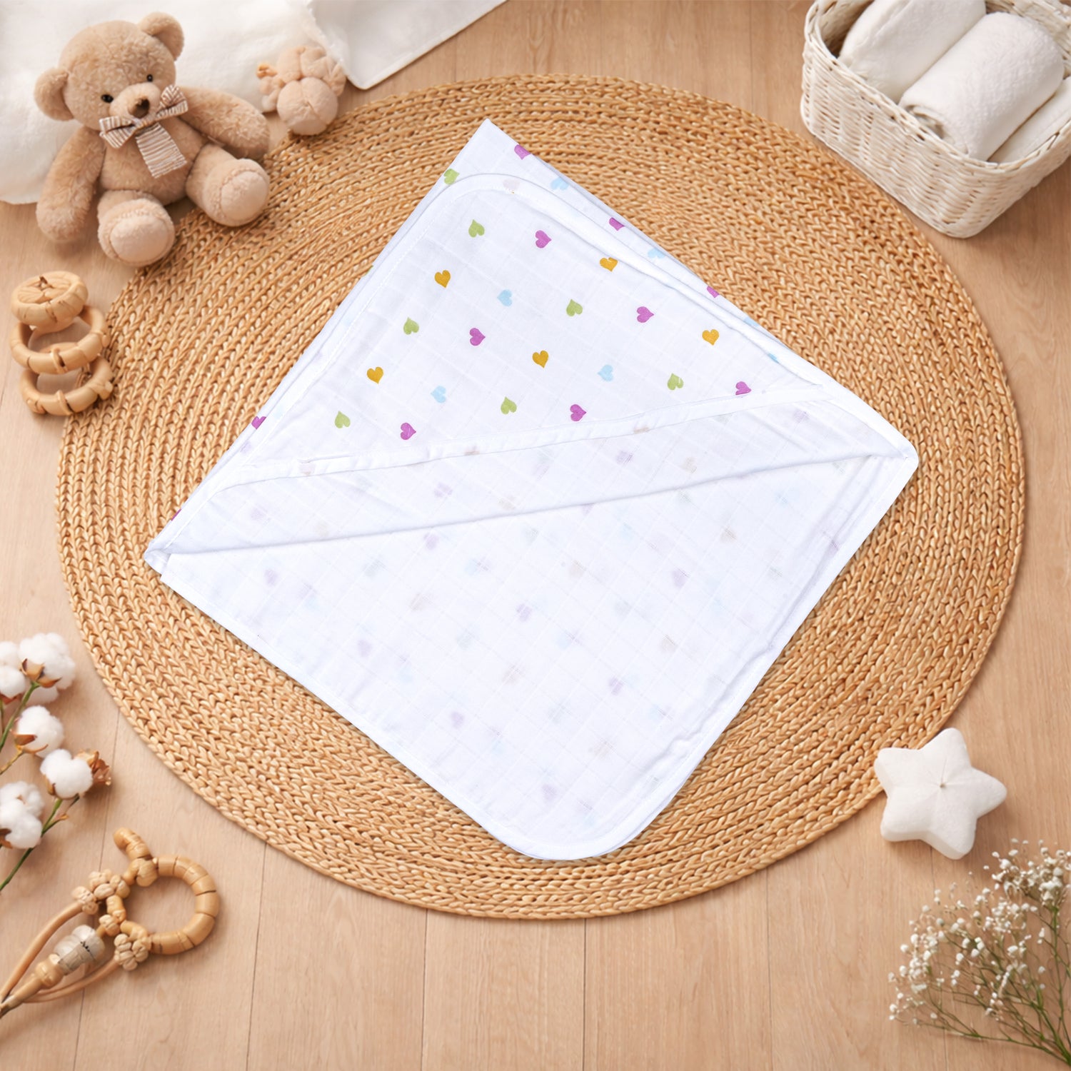 Boonbabies 2-layer printed muslin hooded baby towel with soft, printed design, measuring 70x70 cm, ideal for newborns.