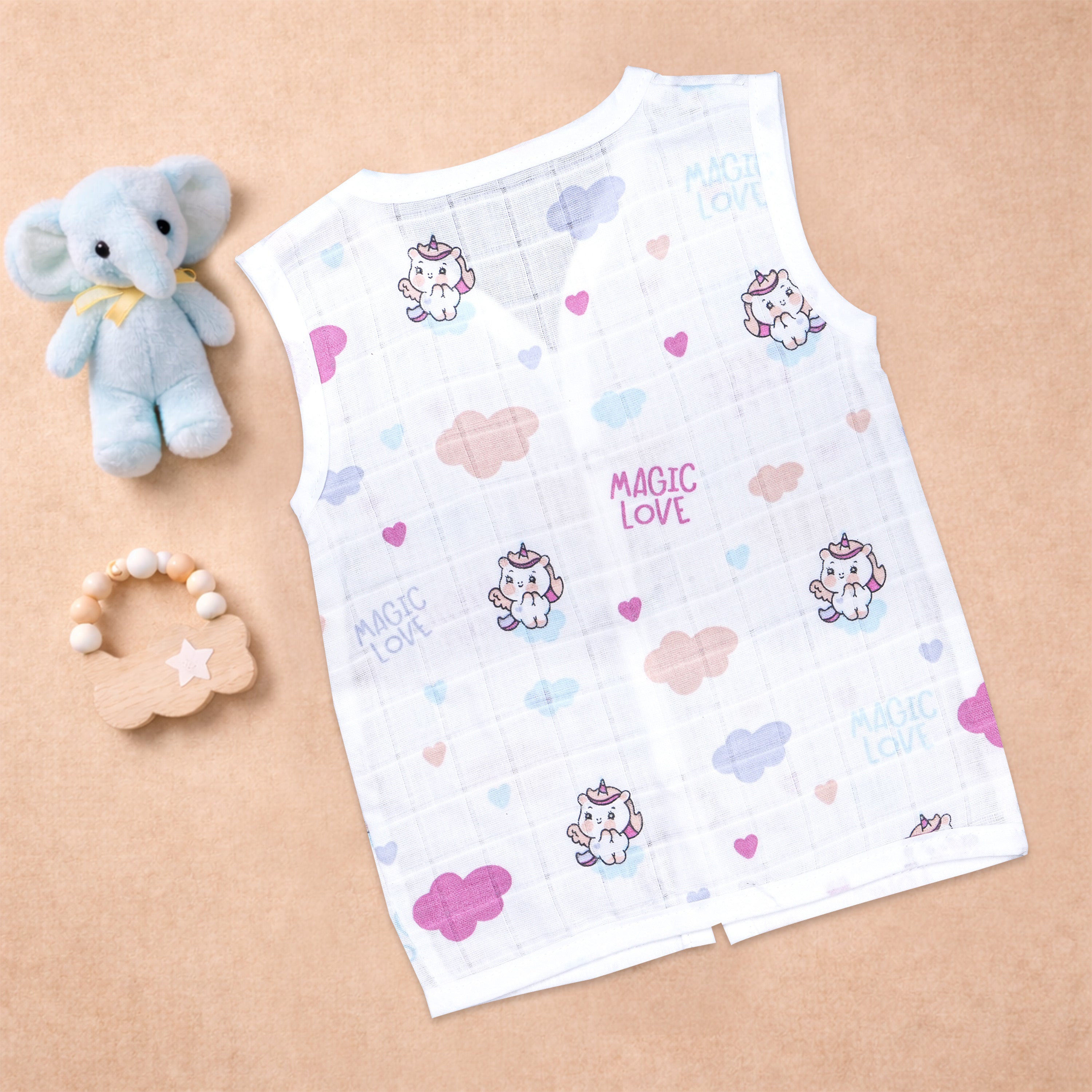 Baby wearing a soft, breathable printed muslin jabla for ages 0-12 months, designed by Boon Babies for newborn comfort.