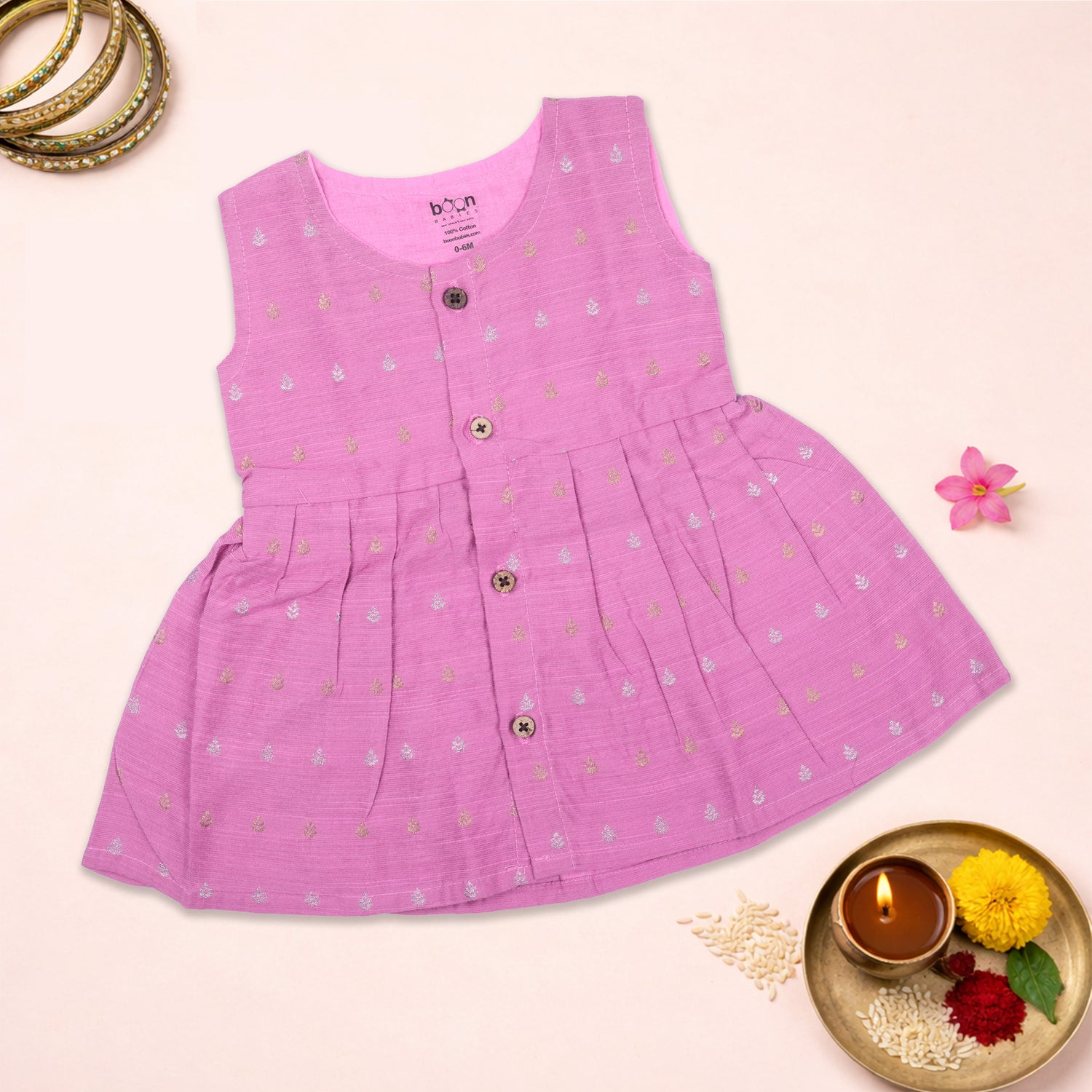 Baby girl ethnic sleeveless frock in baby pink by Boon Babies, featuring traditional design and soft fabric.
