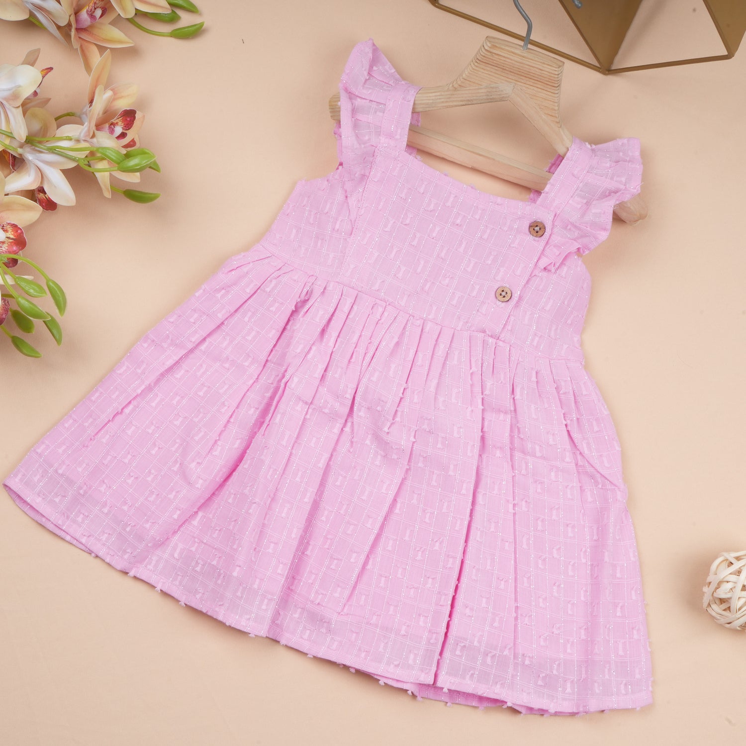 Baby girl in a boonbabies solid frill cotton frock, casual soft twill dress for girls aged 6 months to 5 years.