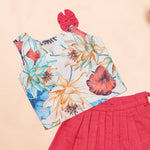 Girls floral pink ethnic top and pleated skirt set by Boon Babies, featuring a colorful floral design and matching pleated skirt.