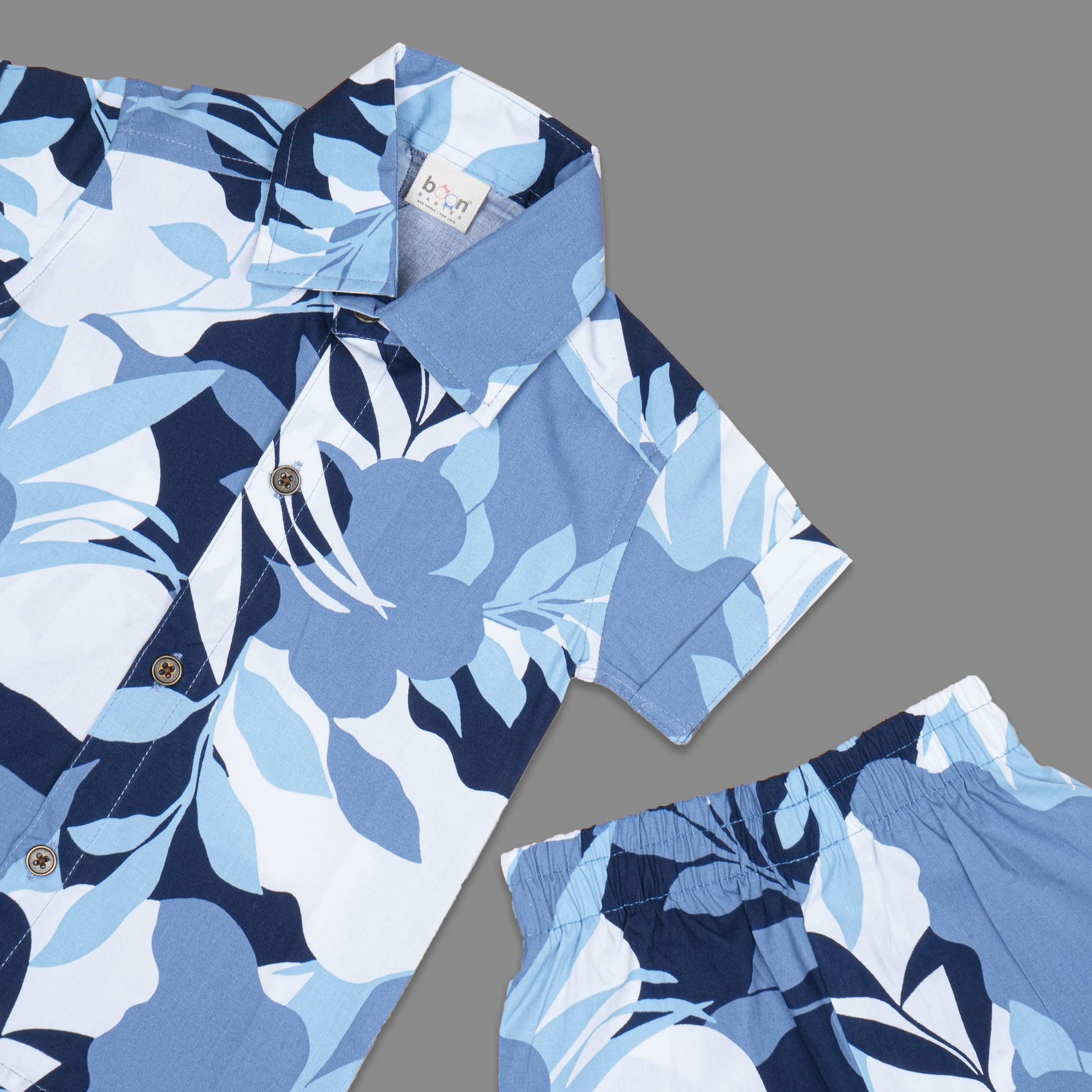 Soft cotton boys co-ord set with floral print, straight collar shirt and comfy shorts—perfect for casual style look and outdoor wear.
