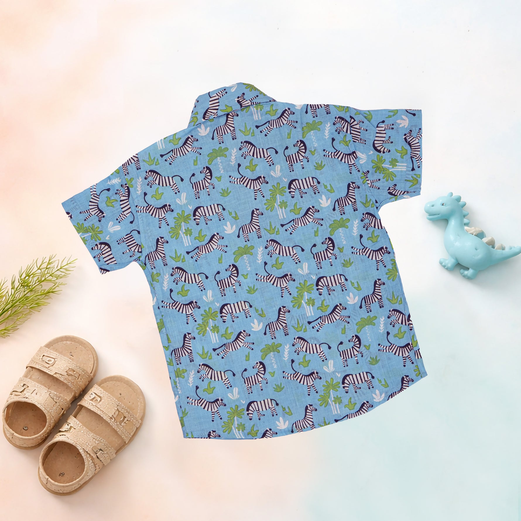 Boy wearing Jaipur Cotton zebra print shirt and shorts set by Boon Babies, featuring a straight collar for summer wear.