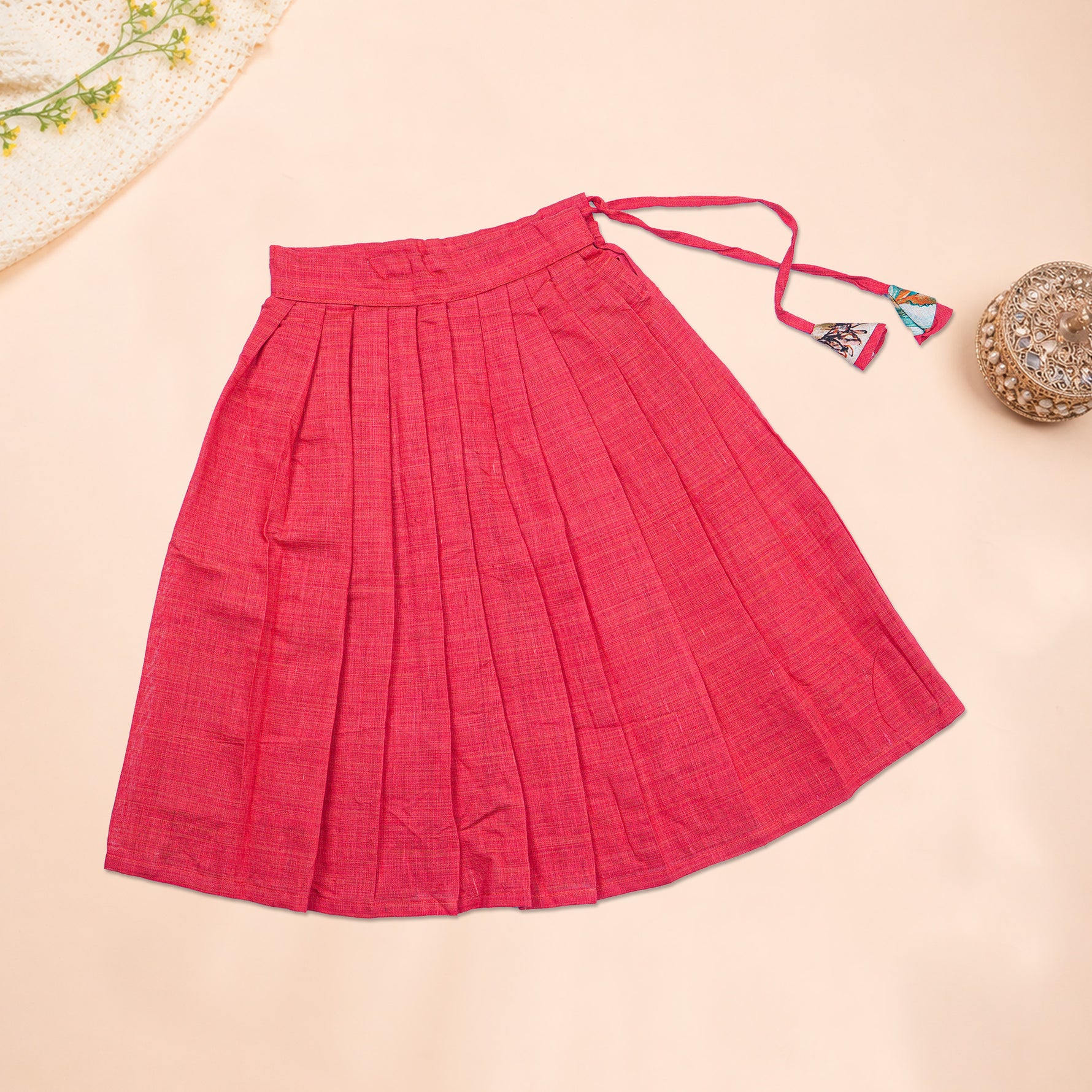 Girls floral pink ethnic top and pleated skirt set by Boon Babies, featuring colorful floral patterns and matching pleated skirt.