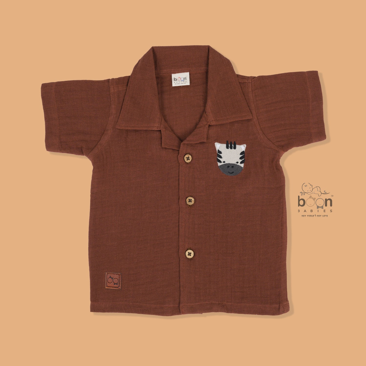 Rust brown crinkle muslin shirt and shorts set with zebra embroidery for boys – soft, breathable kidswear by Boon Babies, Coimbatore.
