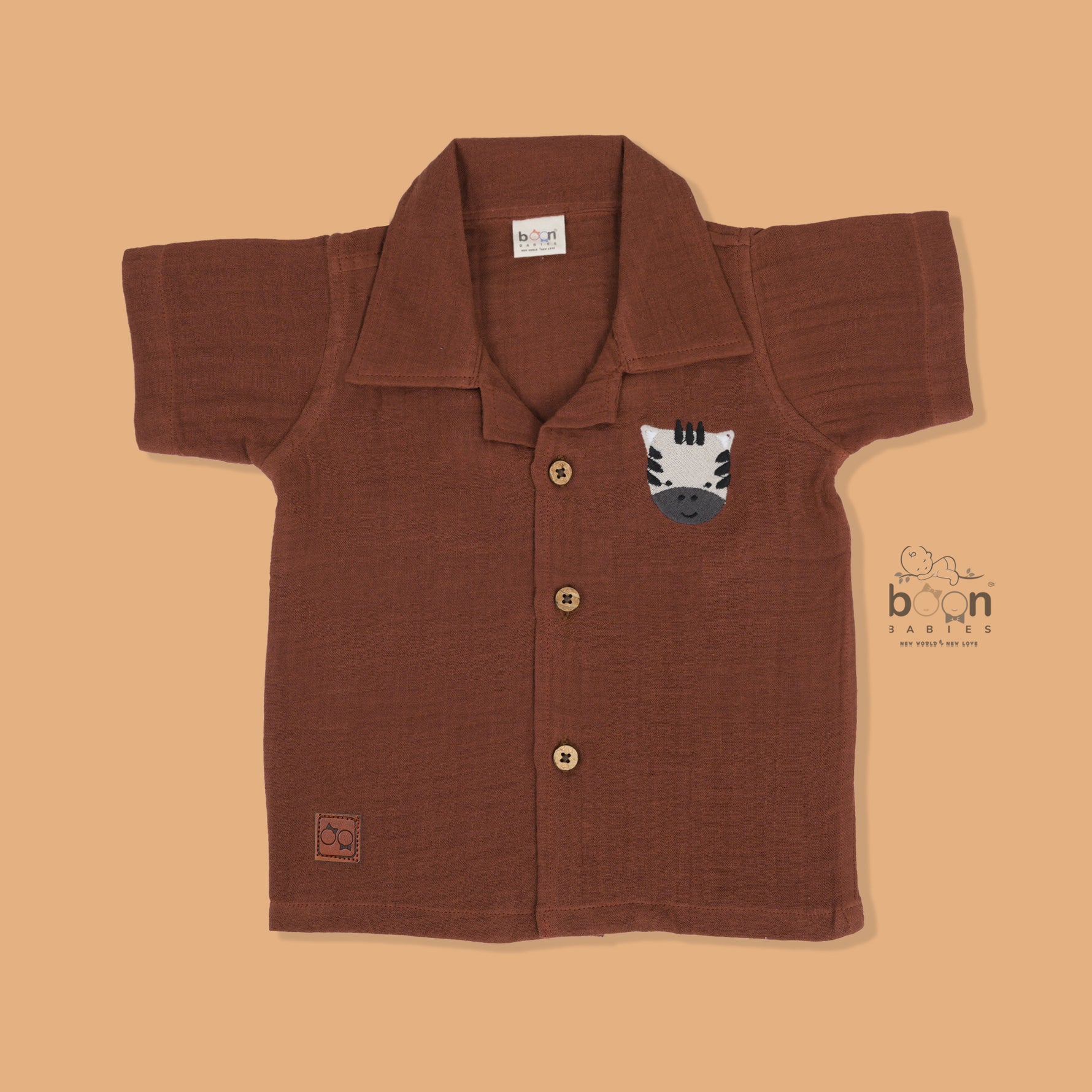 Rust brown crinkle muslin shirt and shorts set with zebra embroidery for boys – soft, breathable kidswear by Boon Babies, Coimbatore.
