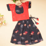 Red and black lotus ethnic skirt set for girls, includes traditional top and skirt by Boon Babies, featuring vibrant cultural design.
