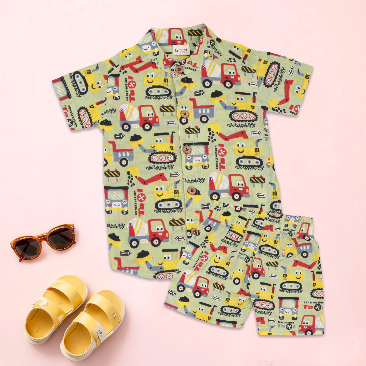 Olive truck print boys co-ord set with a Chinese collar shirt and matching shorts by Boon Babies, featuring a playful truck pattern.