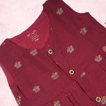 Red ethnic sleeveless frock for baby girls by Boon Babies, featuring traditional design and comfortable fabric.