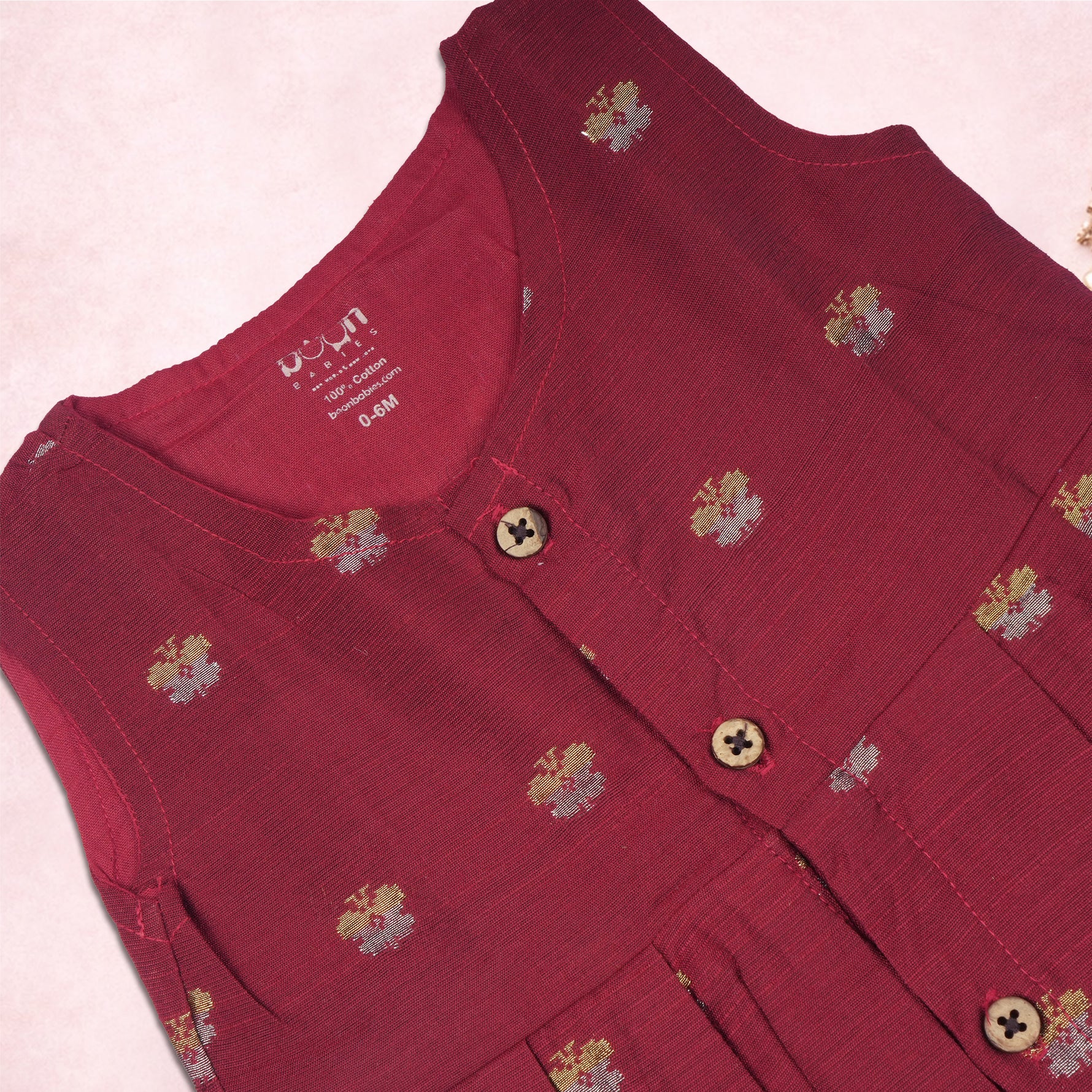 Red ethnic sleeveless frock for baby girls by Boon Babies, featuring traditional design and comfortable fabric.