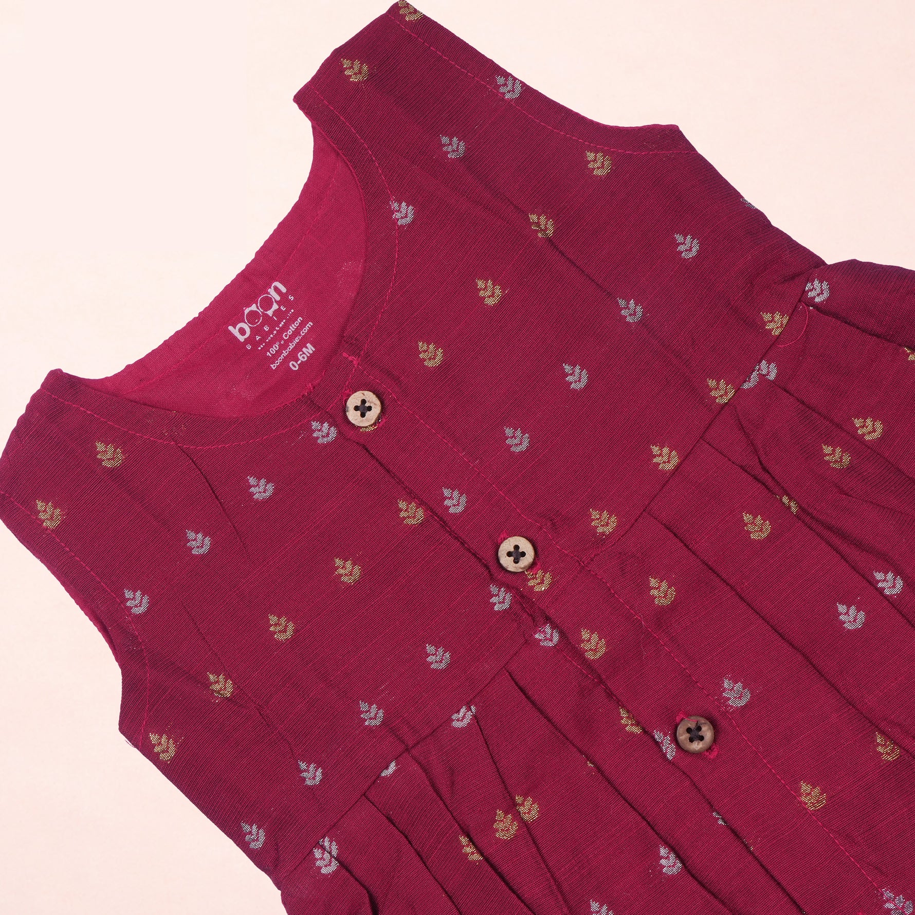 Maroon baby girl ethnic sleeveless frock by Boon Babies with intricate embroidery and comfortable fabric, perfect for special occasions.