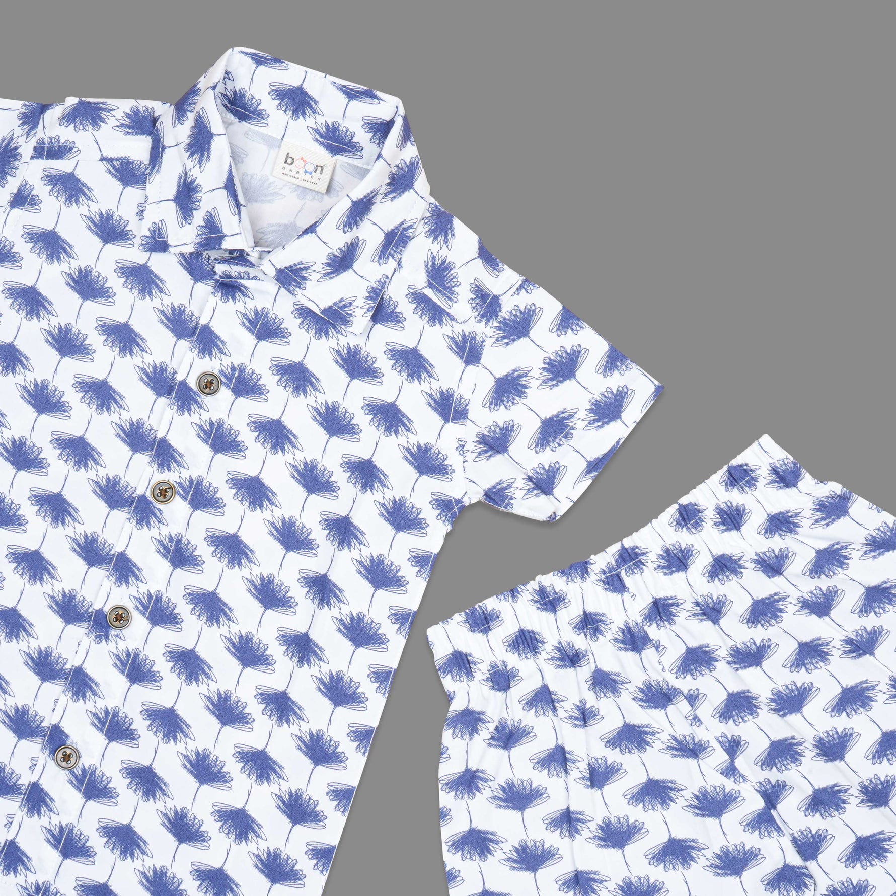 Soft cotton boys co-ord set with blue floral print, straight collar shirt and comfy shorts—perfect for casual style look and outdoor wear.