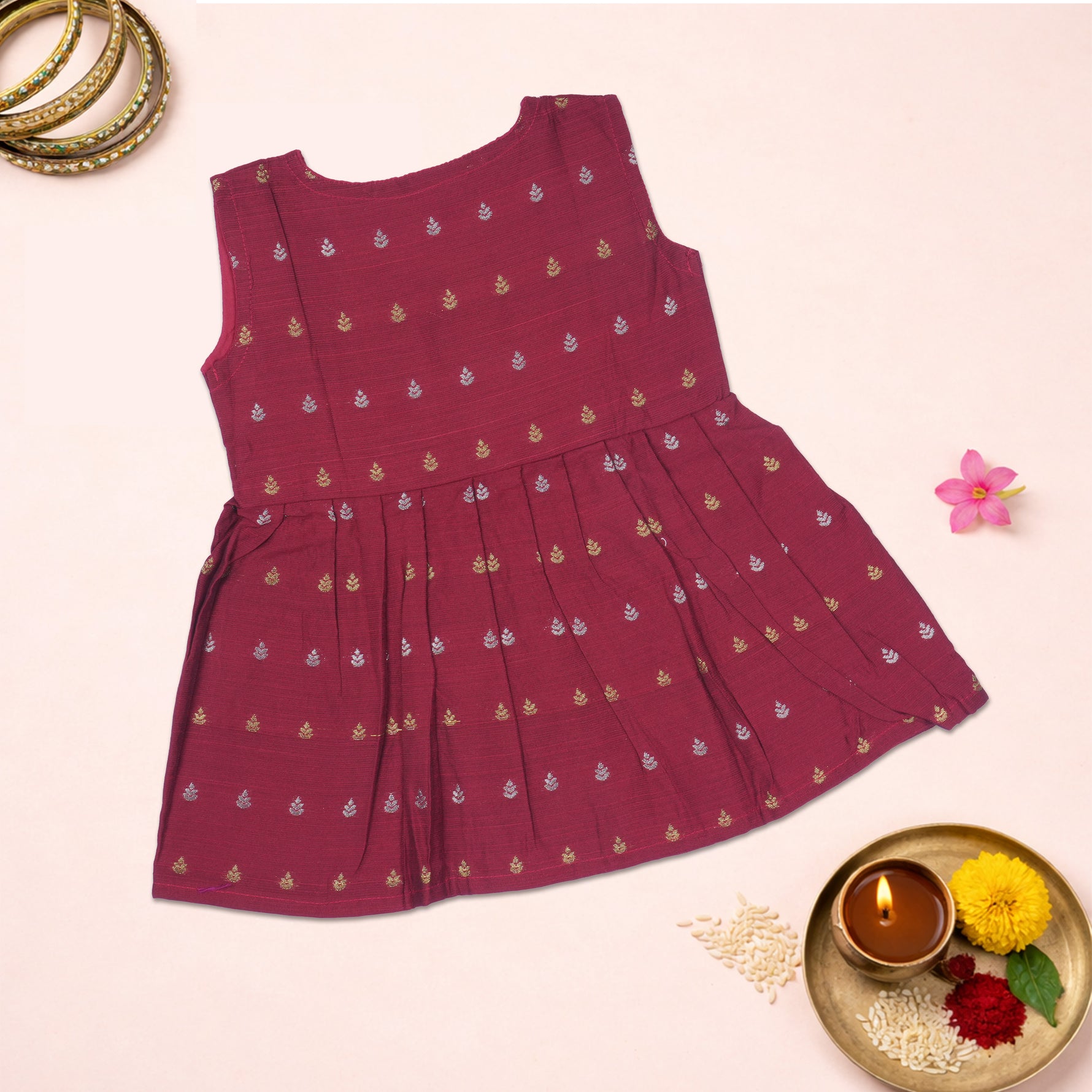 Maroon ethnic sleeveless frock for baby girls by Boon Babies, featuring traditional design and soft fabric.