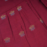 Baby girl ethnic sleeveless frock by Boon Babies in vibrant red fabric, featuring traditional design and decorative patterns.