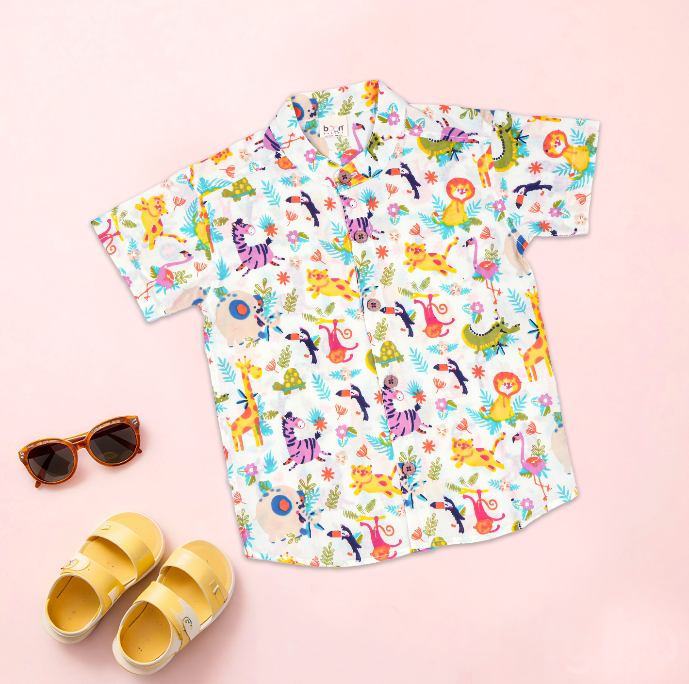 Printed jungle-themed boys co-ord set by Boon Babies with a Chinese collar shirt and matching shorts.
