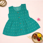 Sea green ethnic sleeveless baby girl frock by Boon Babies with intricate embroidery and floral details.