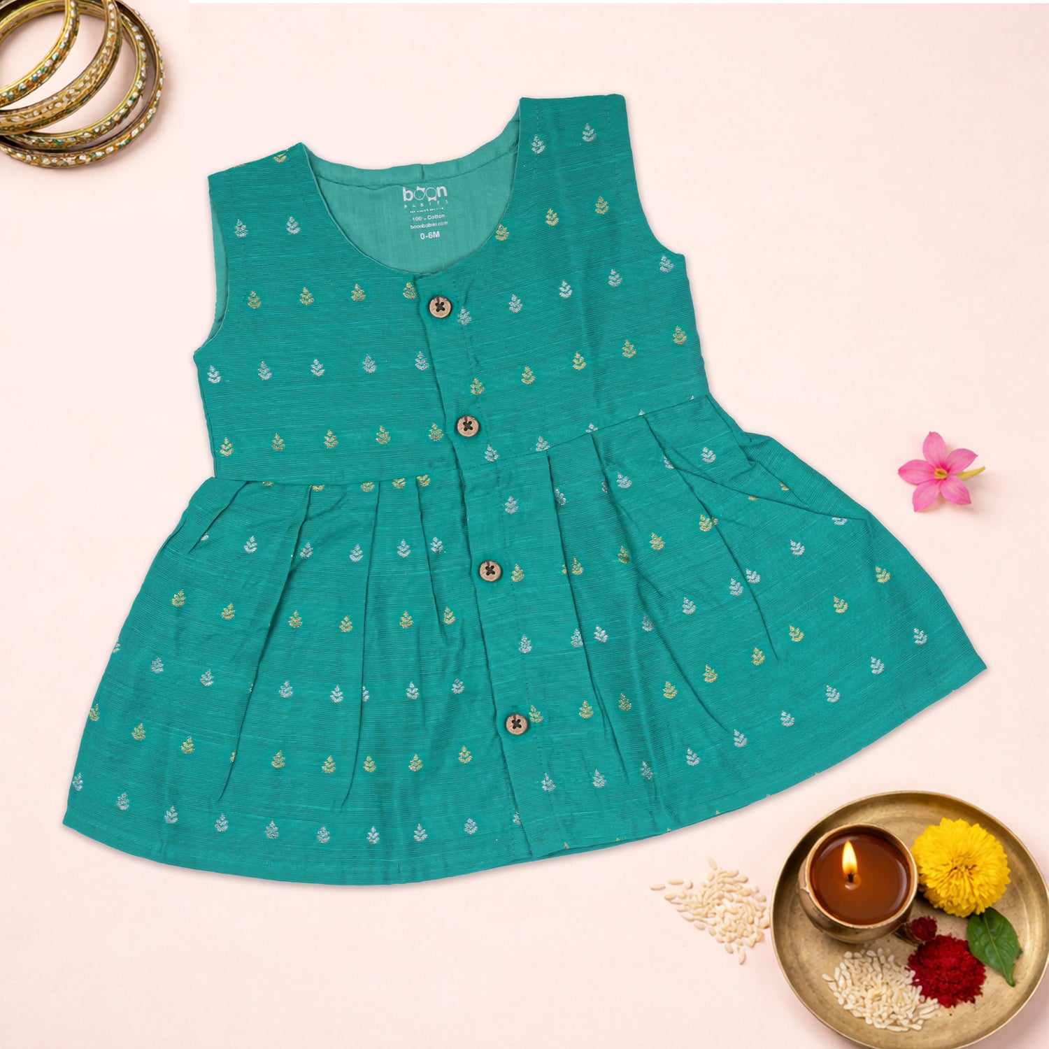 Sea green ethnic sleeveless baby girl frock by Boon Babies with intricate embroidery and floral details.
