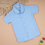 Lightweight solid popcorn shirt for boys by Boon Babies, featuring a regular collar and casual polycotton fabric for ages 6 months to 5 years.