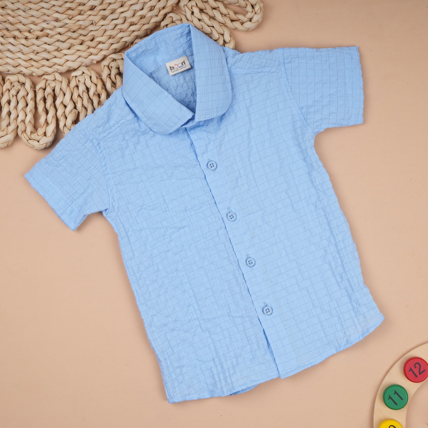 Lightweight solid popcorn shirt for boys by Boon Babies, featuring a regular collar and casual polycotton fabric for ages 6 months to 5 years.