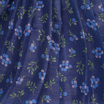 Girls lavender ethnic top and floral pleated skirt set by Boon Babies, featuring a lavender top and colorful floral skirt.