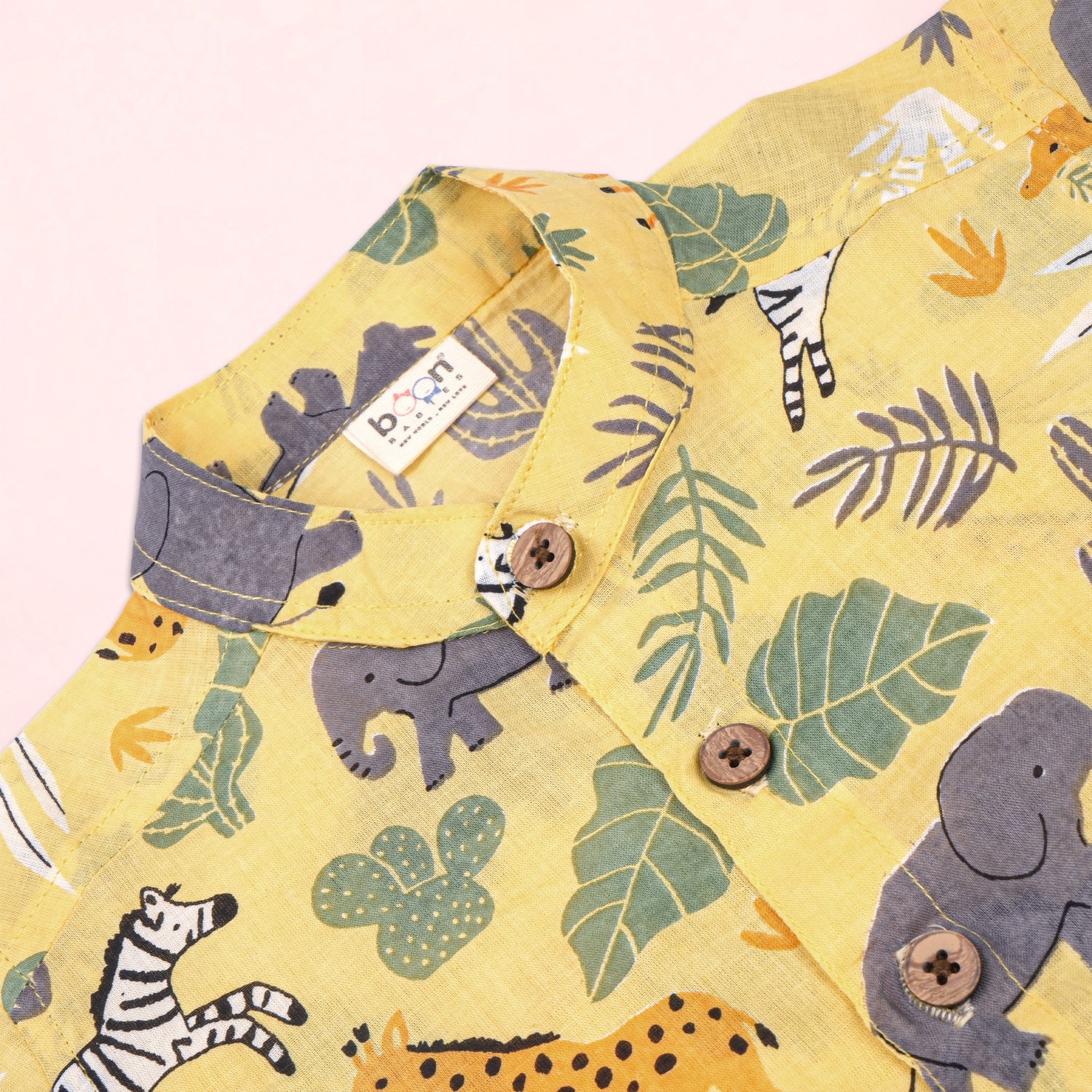 Boon Babies boys safari jungle print co-ord set featuring a Chinese collar shirt and matching shorts with jungle pattern.