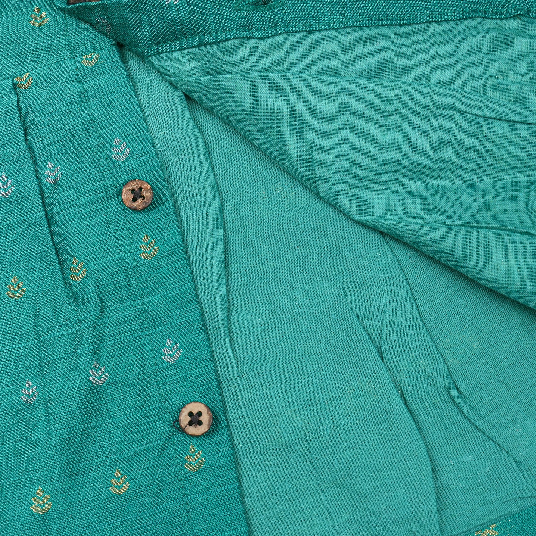 Sea green ethnic sleeveless baby girl frock by Boon Babies, featuring intricate embroidery and a comfortable fit.