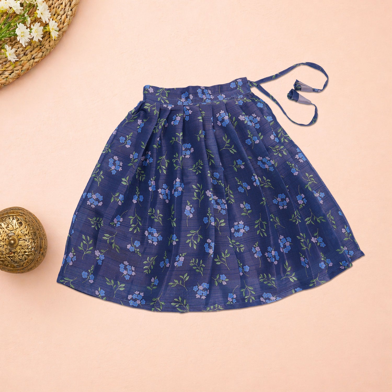 Girls lavender ethnic top and floral pleated skirt set by Boon Babies, featuring a matching lavender top and colorful pleated skirt.