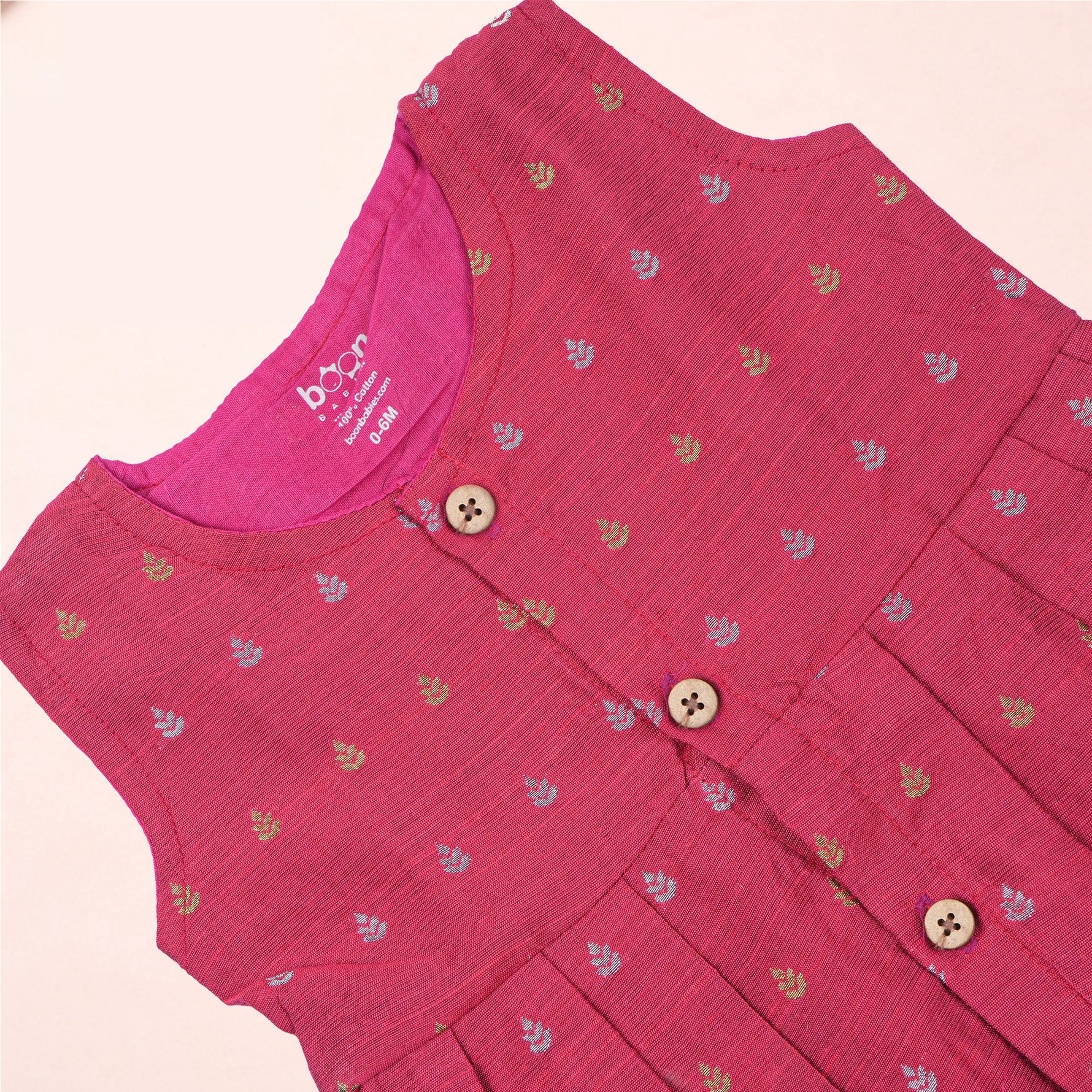 Pink ethnic sleeveless frock for baby girls by Boon Babies, featuring traditional design and soft fabric, perfect for festive occasions.