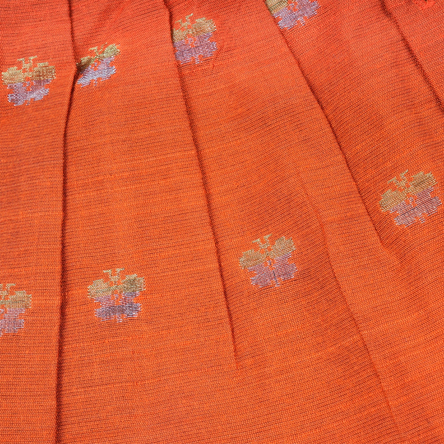 Baby girl wearing a bright orange ethnic sleeveless frock by Boon Babies, featuring traditional embroidery and comfortable fabric.