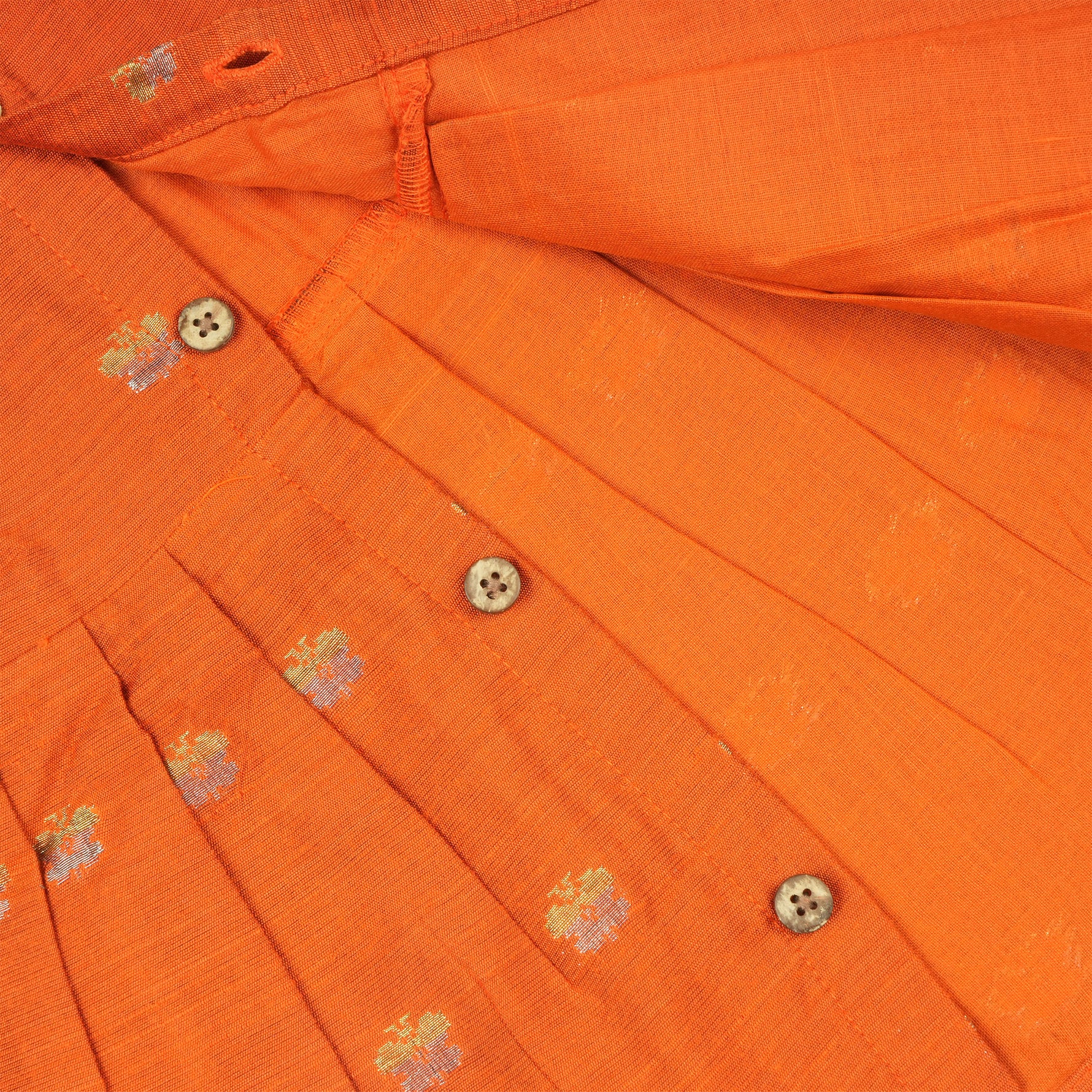 Orange ethnic sleeveless baby girl frock by Boon Babies, featuring traditional design and comfortable fabric.