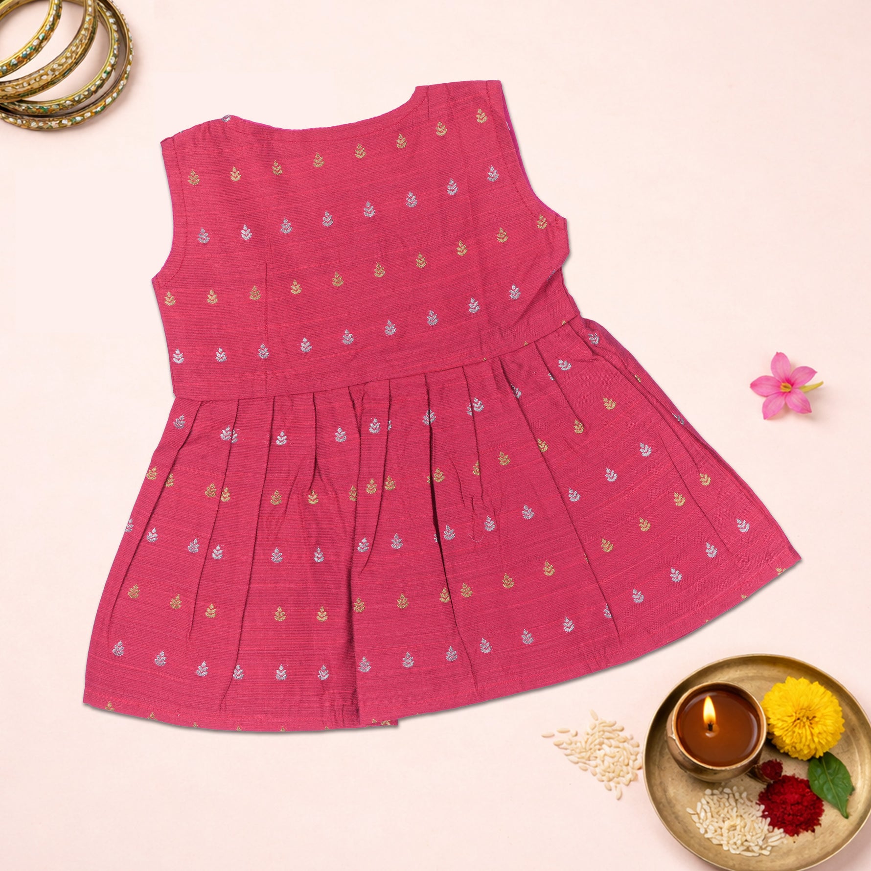 Pink ethnic sleeveless baby girl frock by Boon Babies featuring traditional embroidery and a comfortable fit.