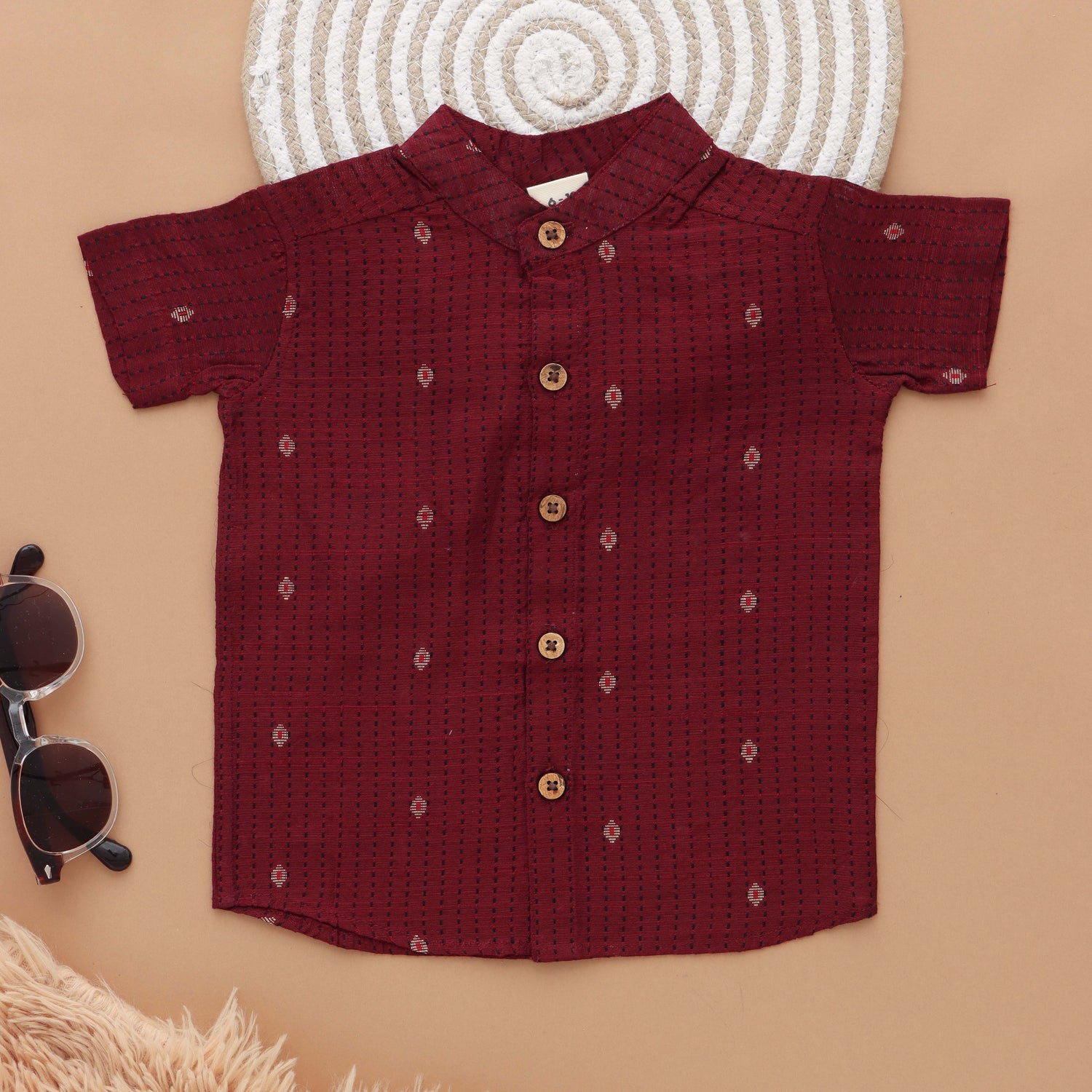 Maroon silk shirt with Mandarin collar paired with white silk dhoti. Ages 6M–5Y. Perfect ethnic festive & wedding wear for boys.
