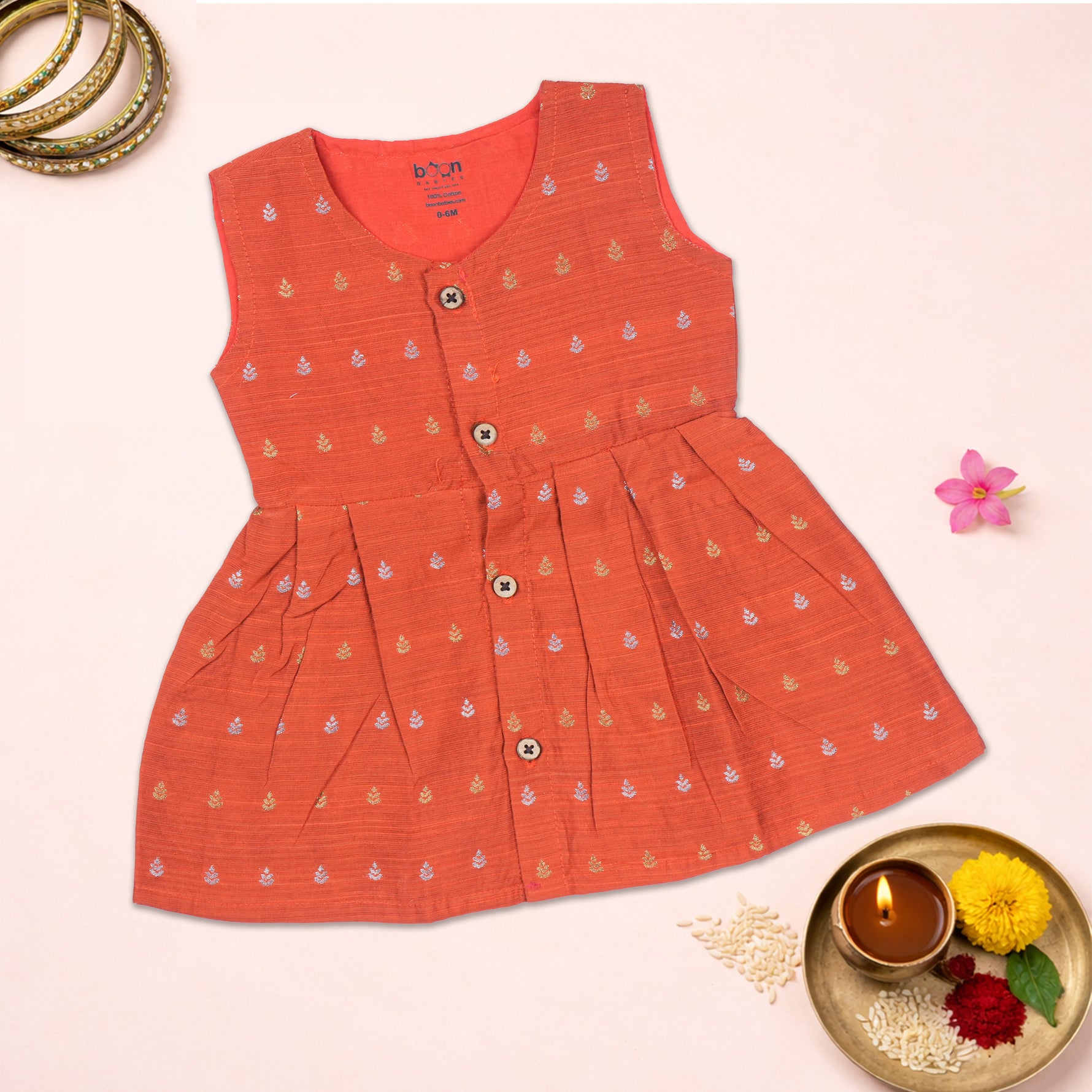 Baby girl ethnic sleeveless frock in bright orange by Boon Babies, featuring traditional design and comfortable fit for special occasions.