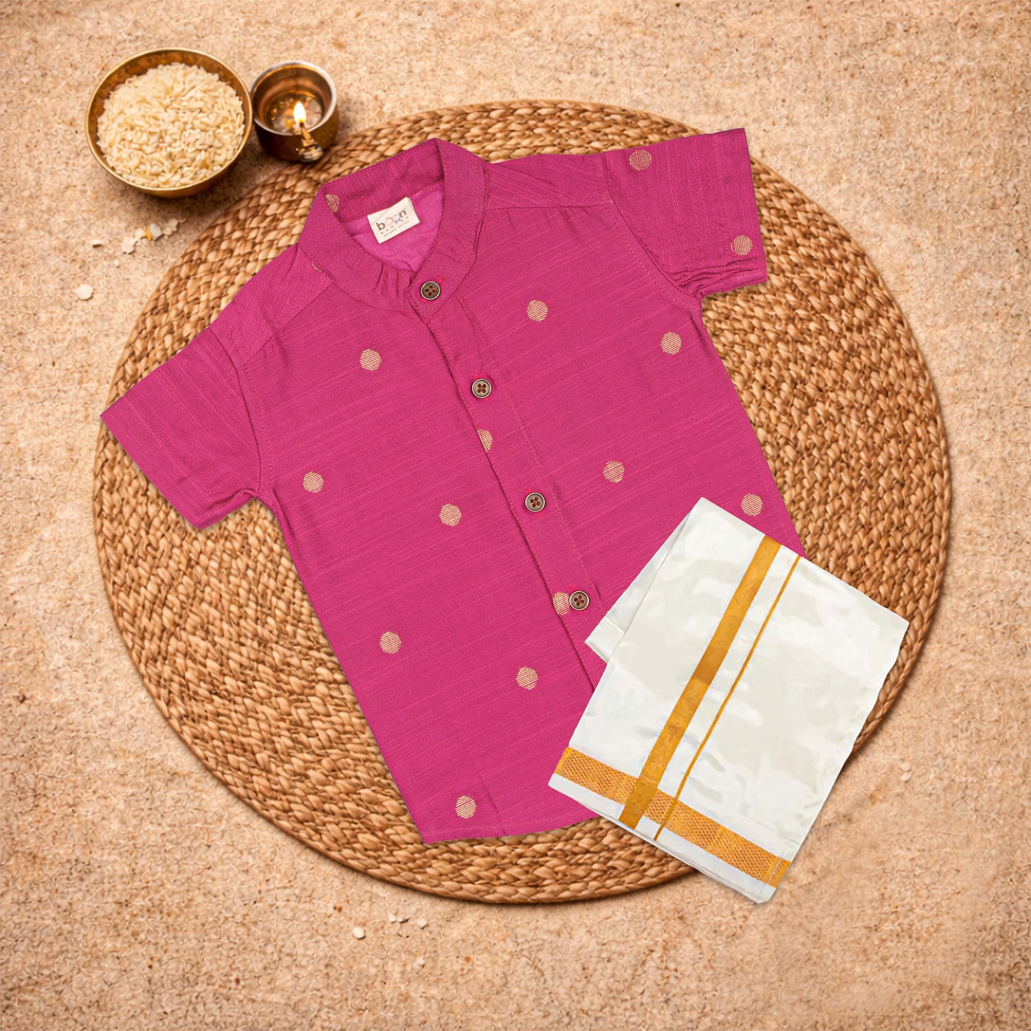 Boys pink silk butta shirt and dhoti set by Booon Babies, traditional festive ethnic outfit for boys, featuring vibrant pink silk fabric.