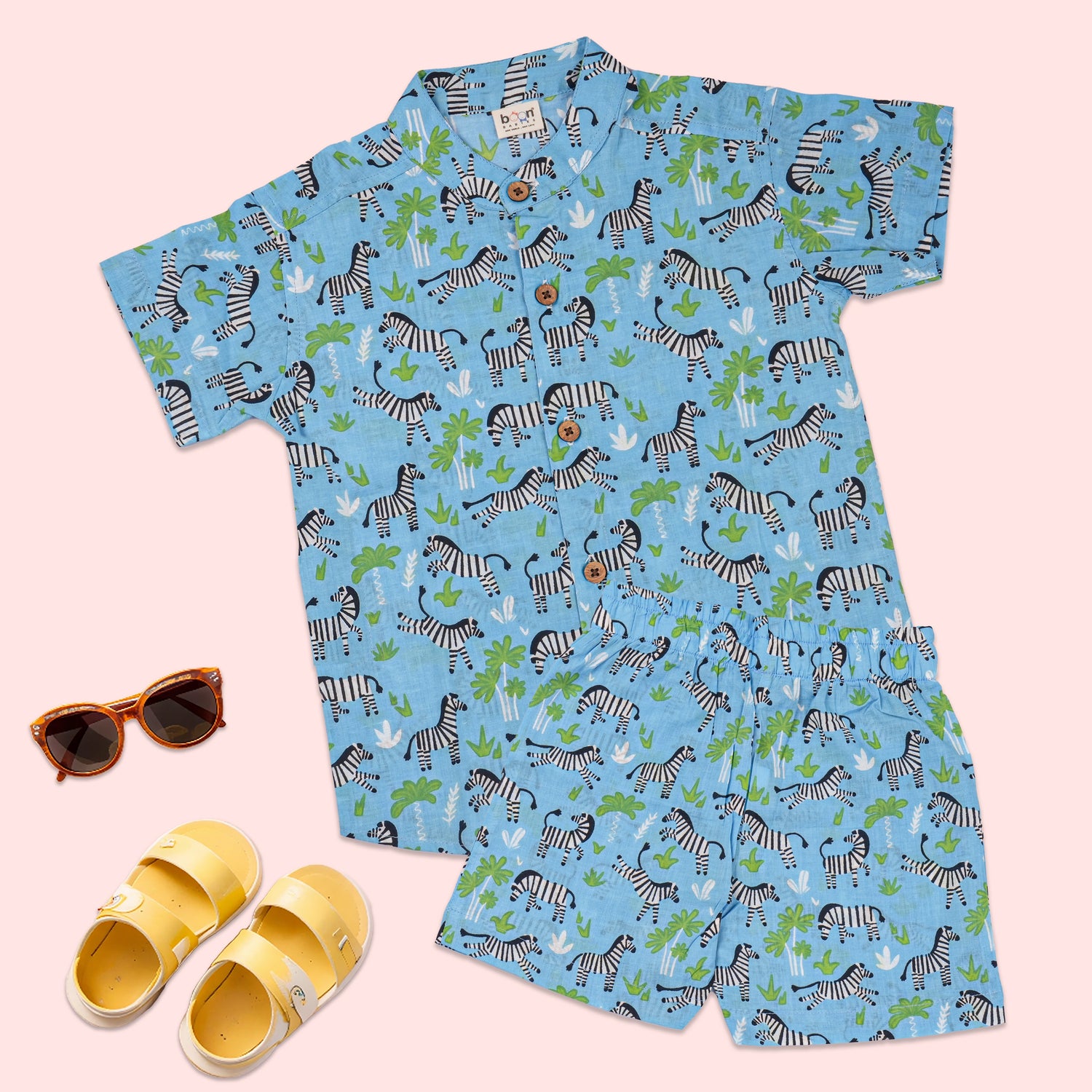 Blue zebra print boys co-ord set featuring a printed shirt with Chinese collar and matching shorts by Boon Babies.
