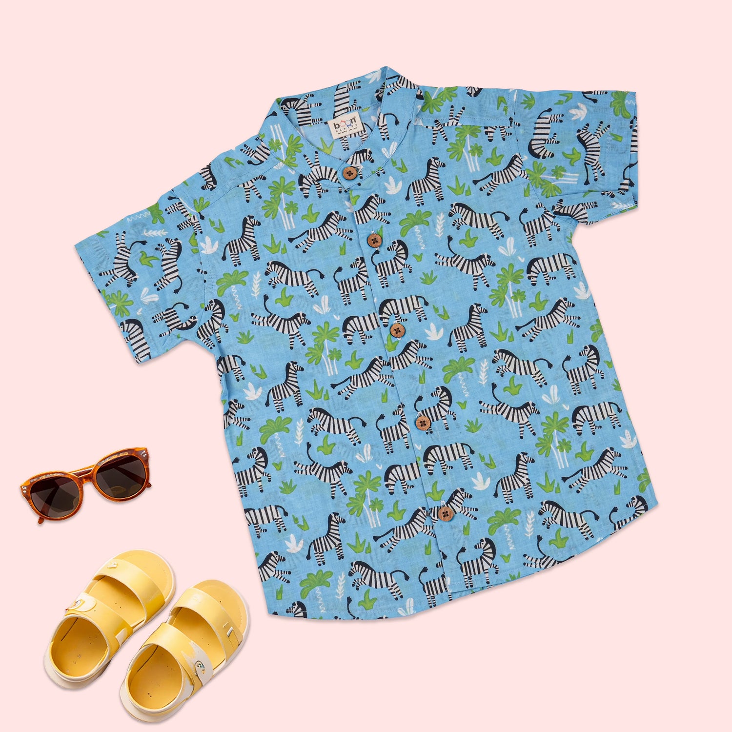 Blue zebra print boys co-ord set with printed shirt and shorts featuring a Chinese collar, by Boon Babies.