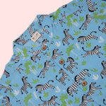 Blue zebra print boys co-ord set with a printed Chinese collar shirt and matching shorts by Boon Babies.