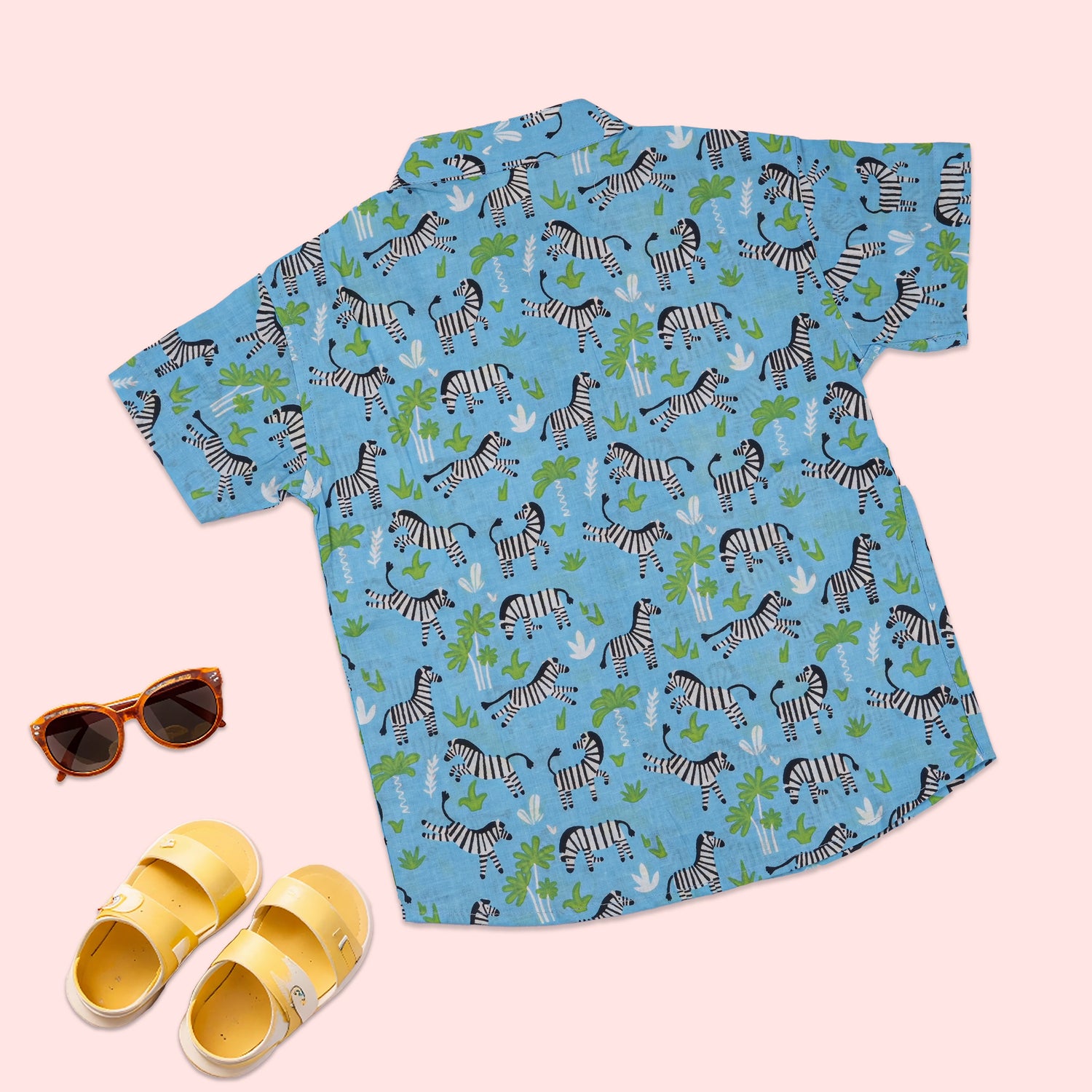 Blue zebra print boys' co-ord set by Boon Babies featuring a printed shirt with Chinese collar and matching shorts.