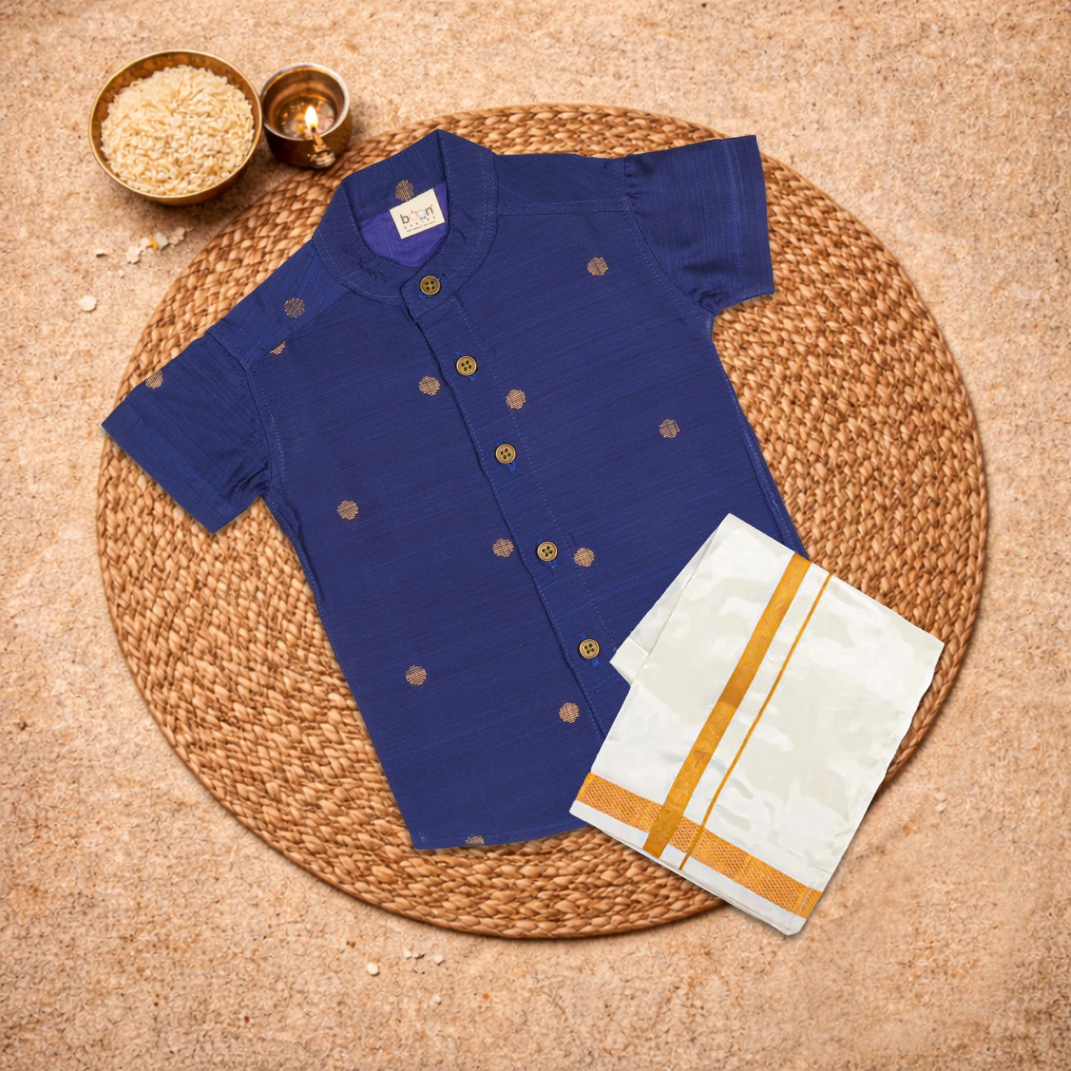 Boy wearing a royal blue silk butta shirt and matching dhoti set from Booon Babies, traditional ethnic wear for boys.