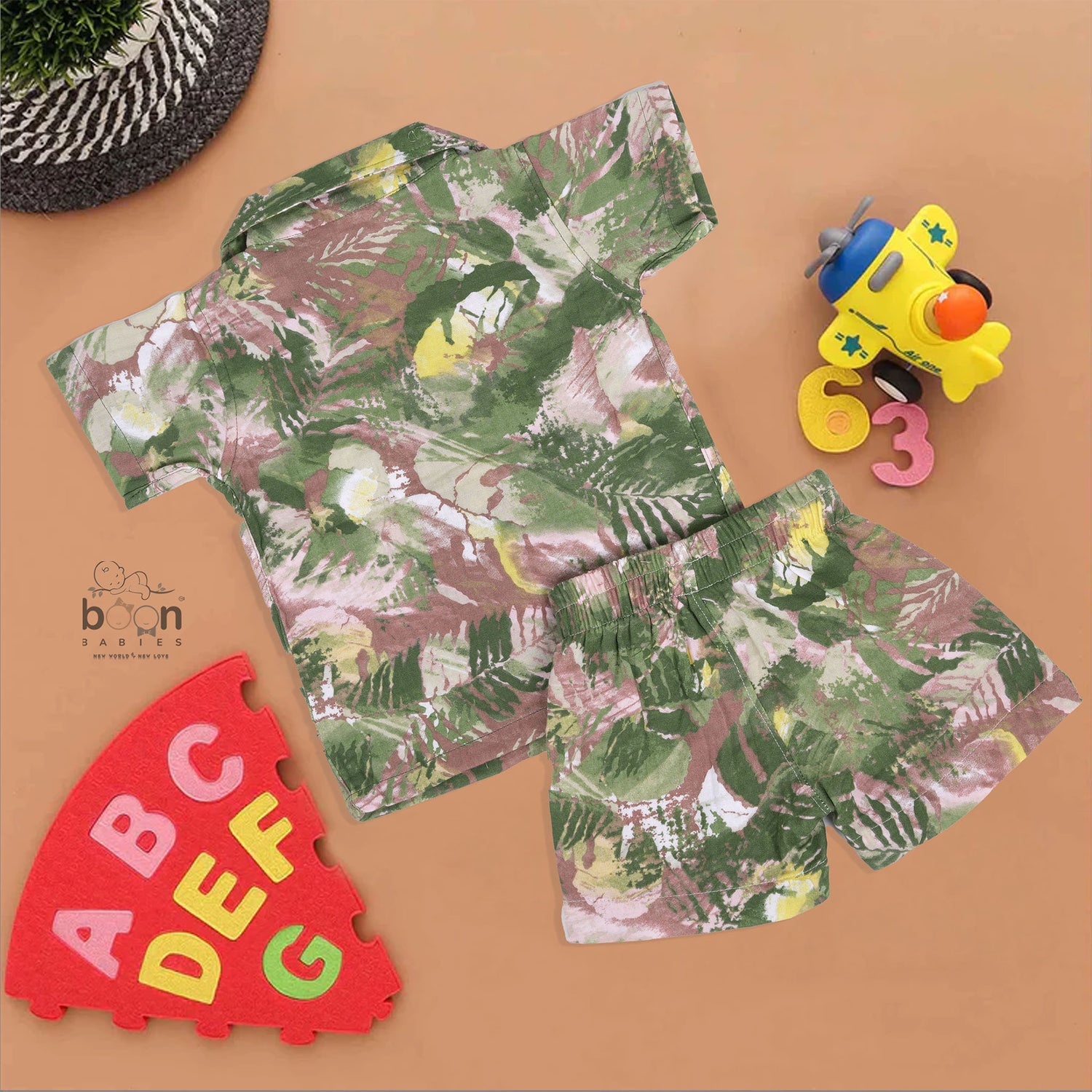 Boys' cotton co-ord set with open collar shirt and shorts, featuring green splash print – from Boon Babies, ideal for 12 months to 5 years.
