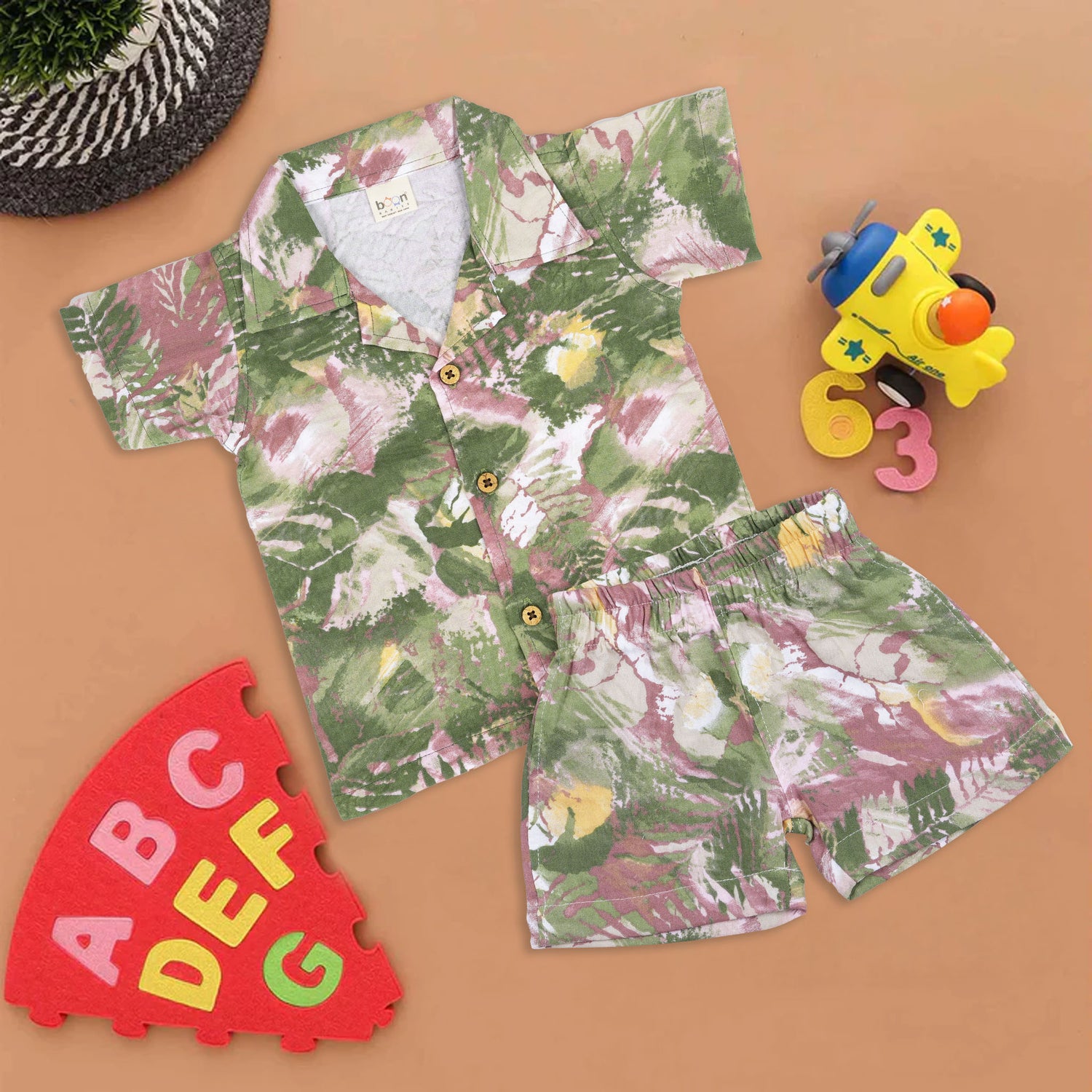 Boys' cotton co-ord set with open collar shirt and shorts, featuring green splash print – from Boon Babies, ideal for 12 months to 5 years.