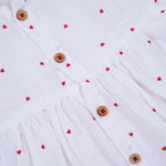 Sweet and soft muslin baby frock with red heart prints. Ages 3–18 months. Designed for comfort, perfect for everyday cuteness.
