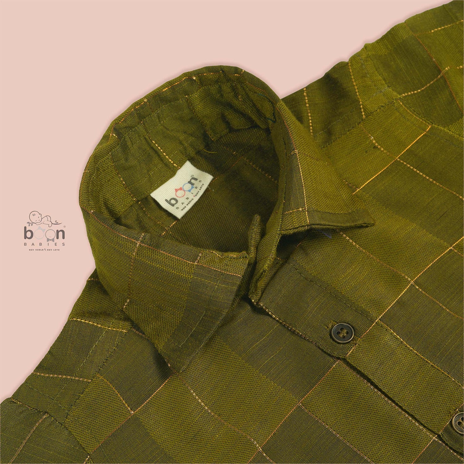 Olive green silk shirt with golden check pattern, folded neatly – traditional ethnic wear for baby boys from Boon Babies, Coimbatore.