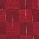 Rich red silk shirt with golden check pattern, folded neatly beside a white veshti – premium festive shirt for boys from Boon Babies, Coimbatore