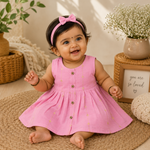 Baby girl wearing a pink ethnic sleeveless frock by Boon Babies, featuring traditional embroidery and comfortable fabric.