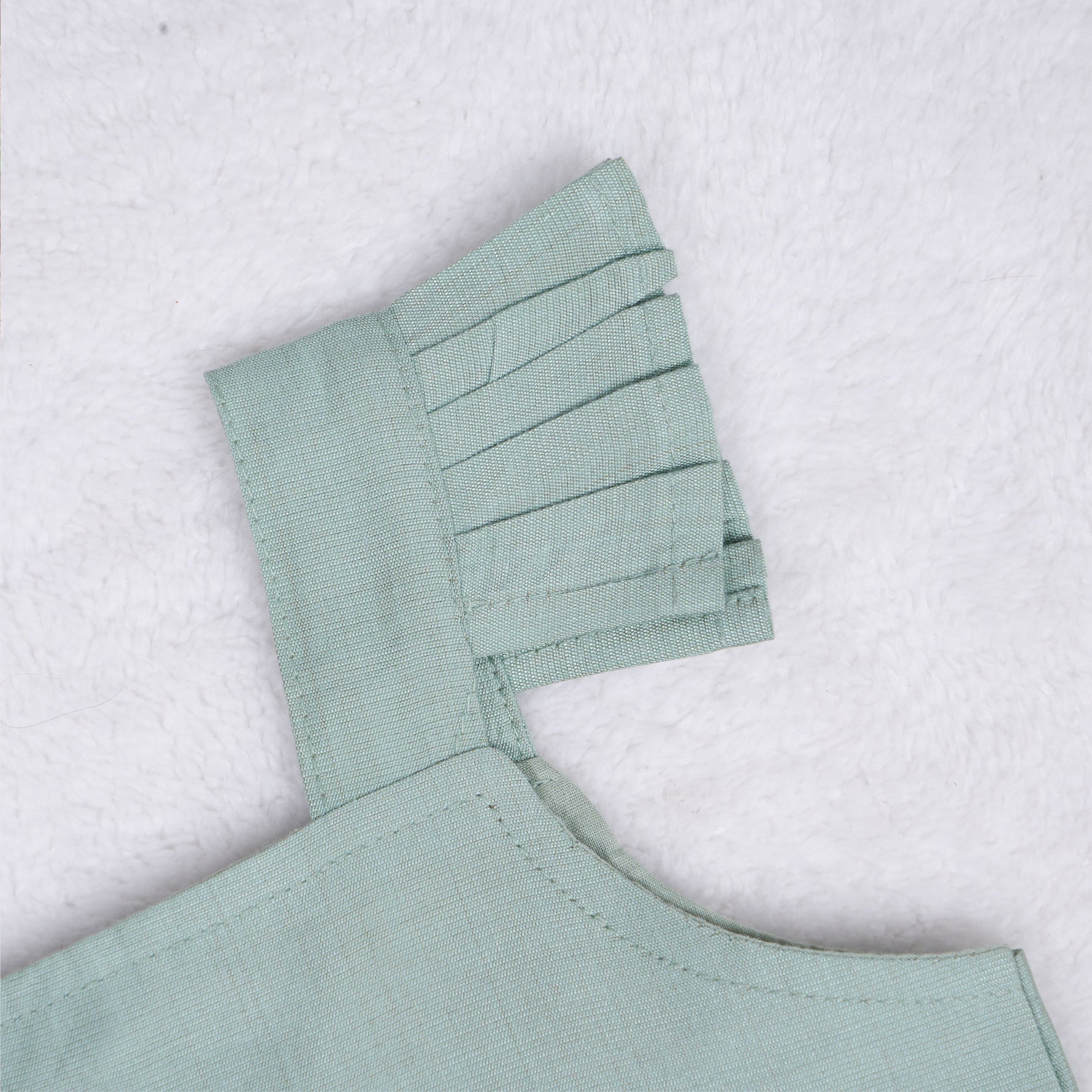 Mint green embroidered cotton top with cream skirt, elastic waist and lining – elegant Kerala-style ethnic wear for girls aged 1–5 years.