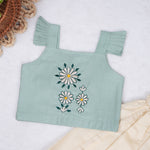 Mint green embroidered cotton top with cream skirt, elastic waist and lining – elegant Kerala-style ethnic wear for girls aged 1–5 years.